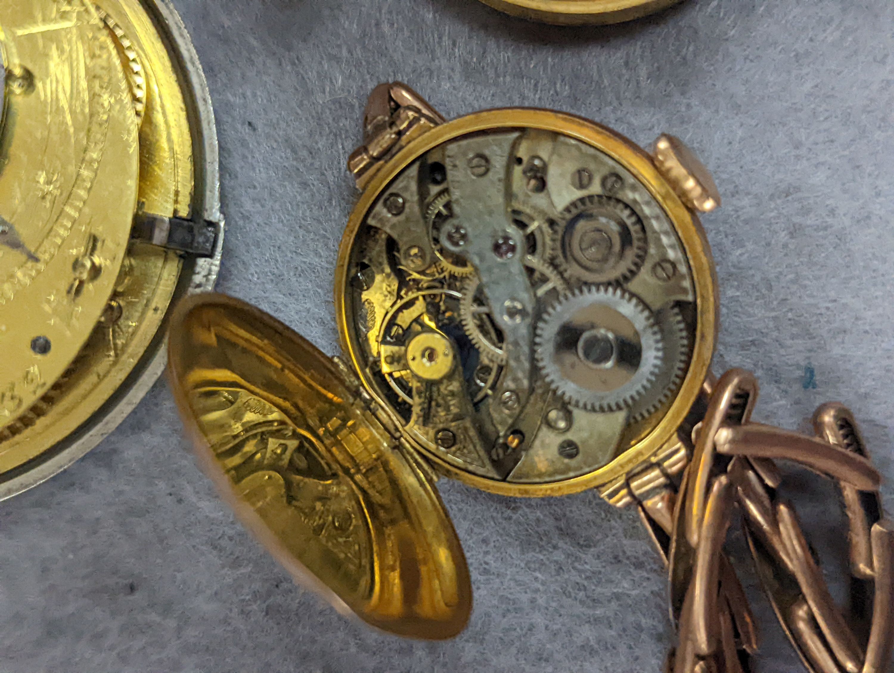 An 18k fob watch(a.f.) gross 20.4 grams, a 9ct wrist watch on a 9ct expanding bracelet, gross 20.7 grams, a gold plated pocket watch, an 800 fob watch and a 19th century silver pair cased verge keywind pocket watch, by J